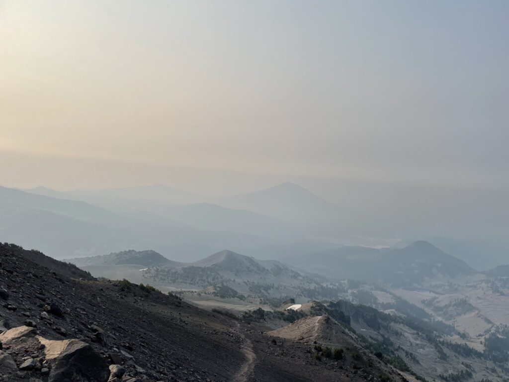 Smoky view of the cascade mountains from the top of South Sister near Bend