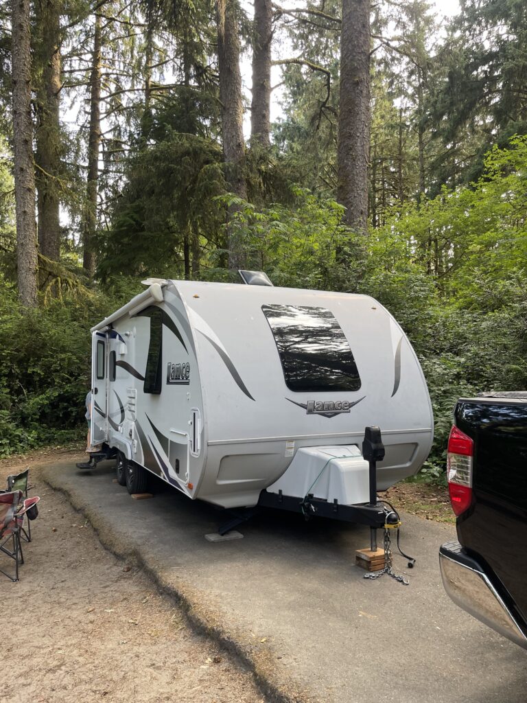 Travel trailer camping at Fort Stevens State Park near Astoria, Oregon