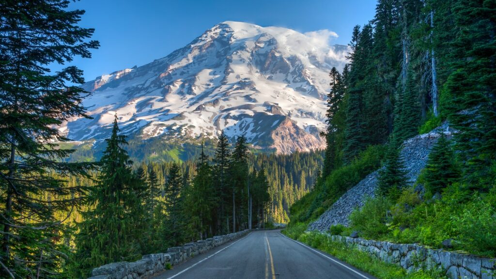 Mt Ranier and park road in Mt Ranier National Park, Washington. Glaciers and snow are visible.