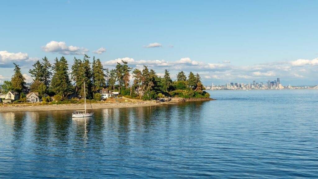 Secluded residences on Bainbridge Island with skyline of Seattle in the background, WA, USA