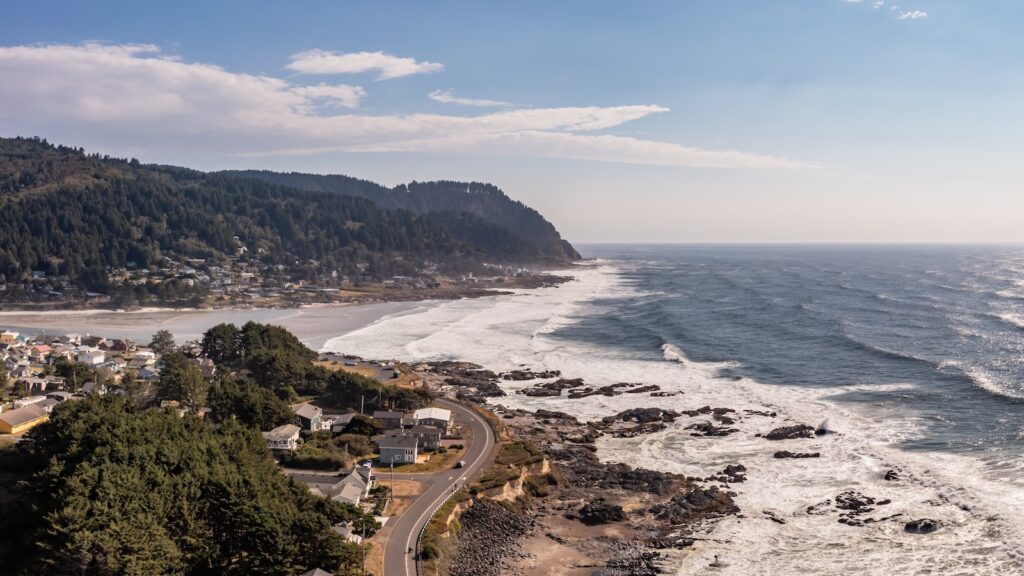 The town of Yachats at the central Oregon Coast. Highway 101 winding through town. Aerial panorama.